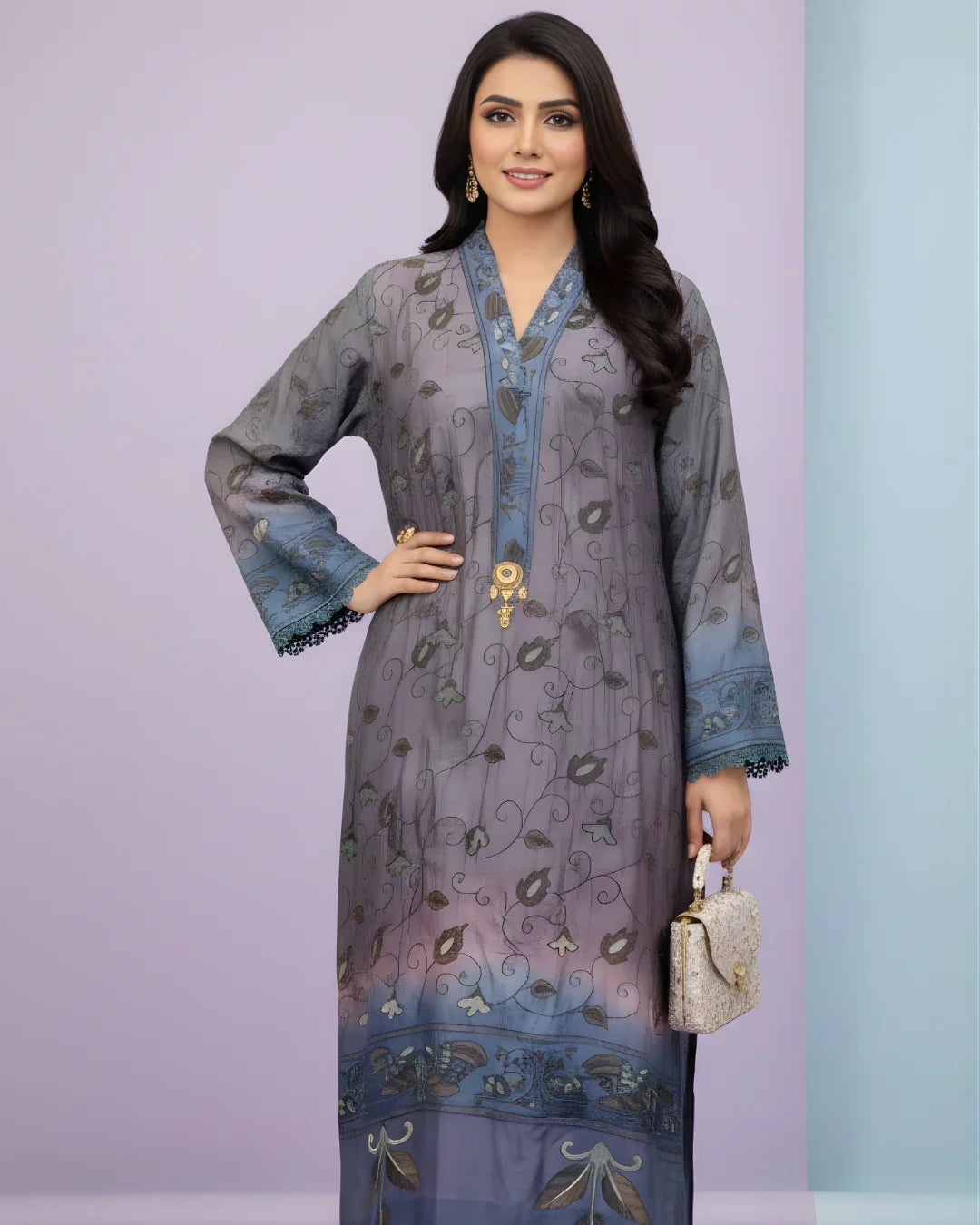 Woman wearing a blue embroidered long kurta dress holding a handbag, elegant festive attire