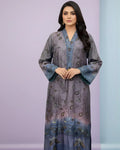 Woman wearing a blue and purple floral embroidered kurta with long sleeves, standing indoors