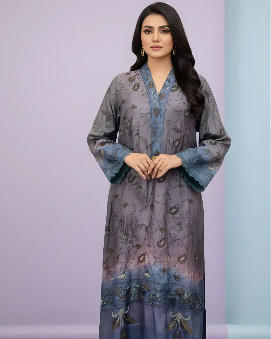 Woman wearing a blue and purple floral embroidered kurta with long sleeves, standing indoors